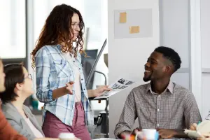 group of young adults in an office, collaboratively talking